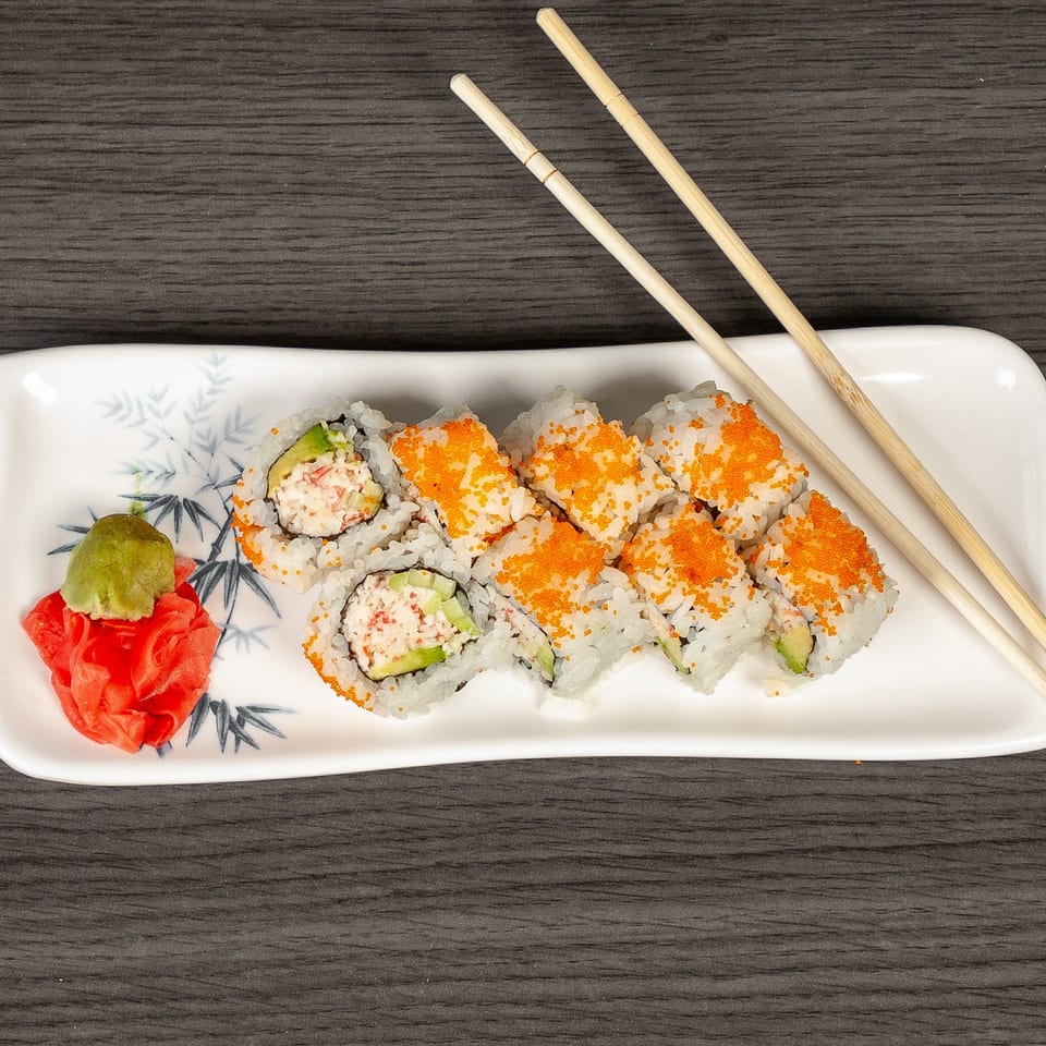 California sushi rolls with crab, avocado, and orange roe, served with wasabi and ginger.