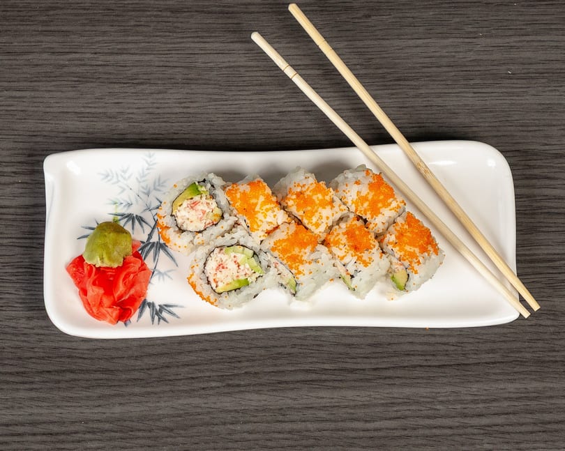 California sushi rolls with crab, avocado, and orange roe, served with wasabi and ginger.